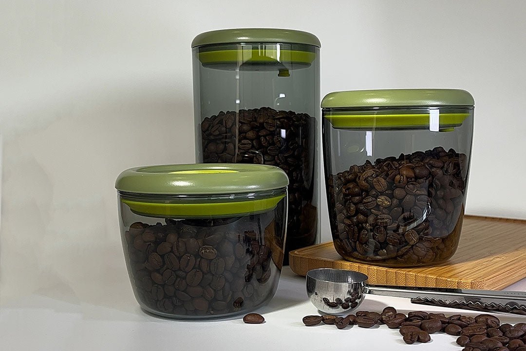 A rustic coffee storage setup featuring traditional ceramic jars and modern airtight canisters, symbolizing the blend of cultural heritage and innovation in preserving coffee freshness.