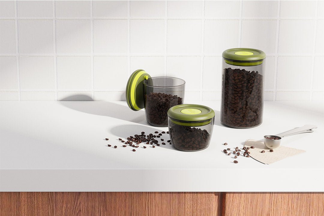 iKoffy FreshGuard Coffee Canisters with one-way air valve, preserving coffee freshness, placed on a kitchen countertop.