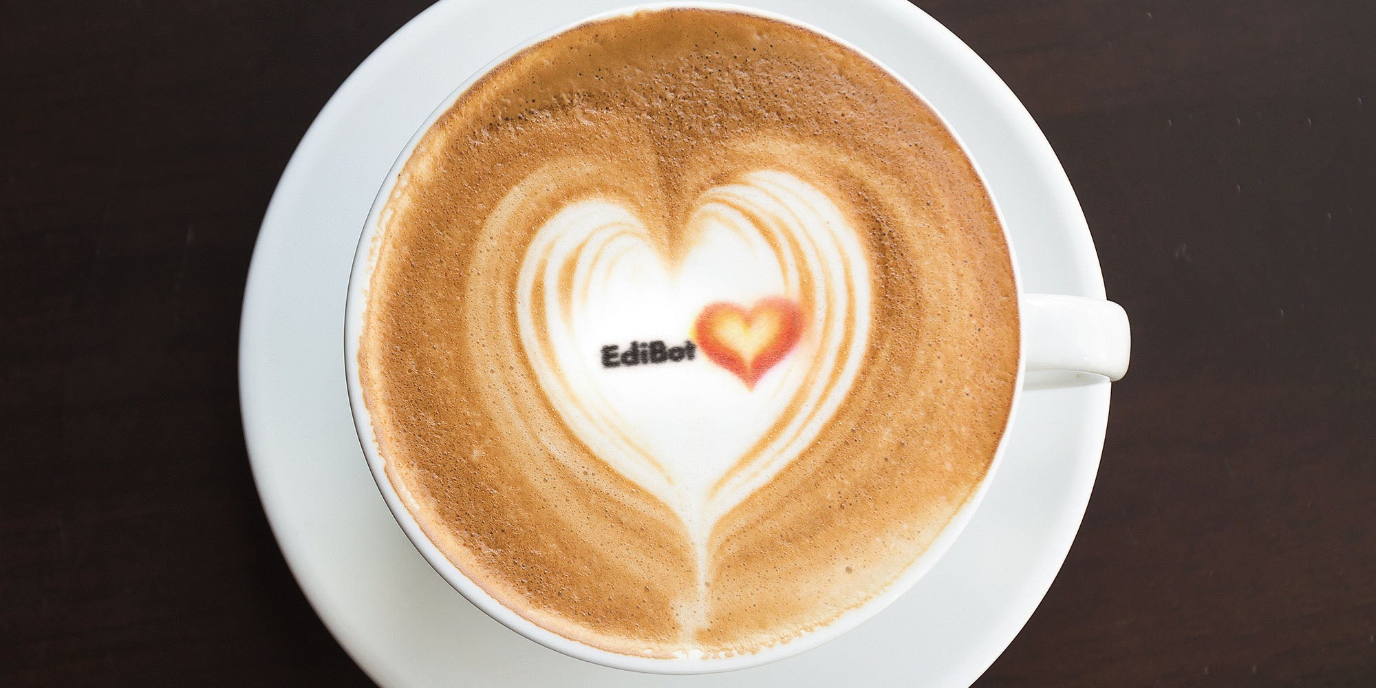 Edible latte art printed by iKoffy EdiBot – high-definition food inkjet printing on coffee foam.