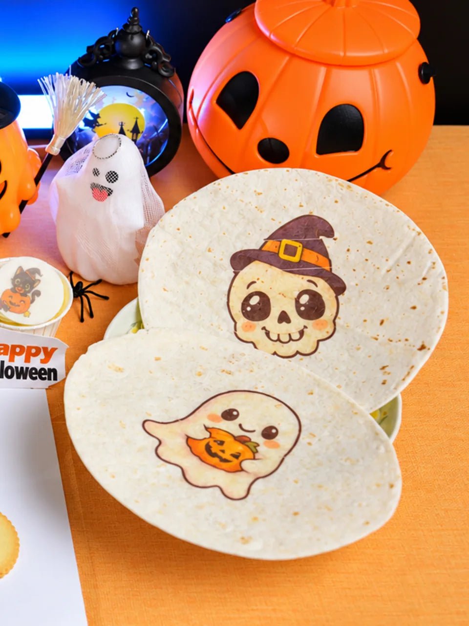 A ghost and a skull wearing a witch hat printed on tortillas.