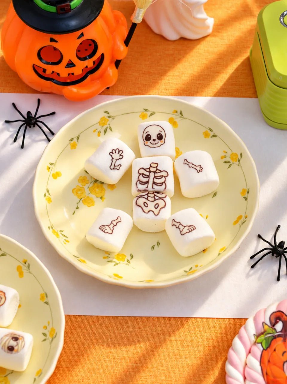 Printed marshmallows arranged as a Halloween skeleton.