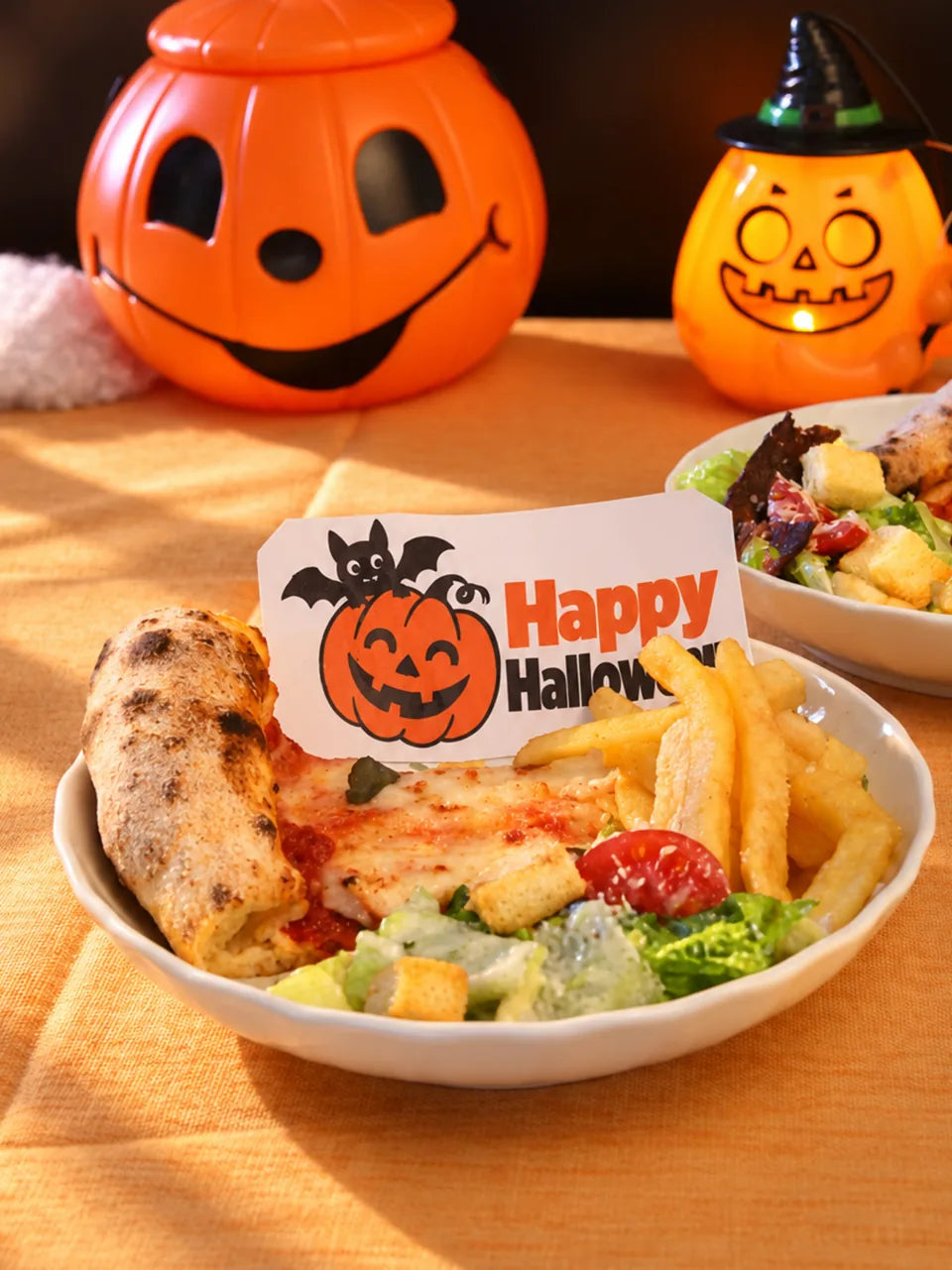 A printed Happy Halloween icing-sheet topper served with a meal.